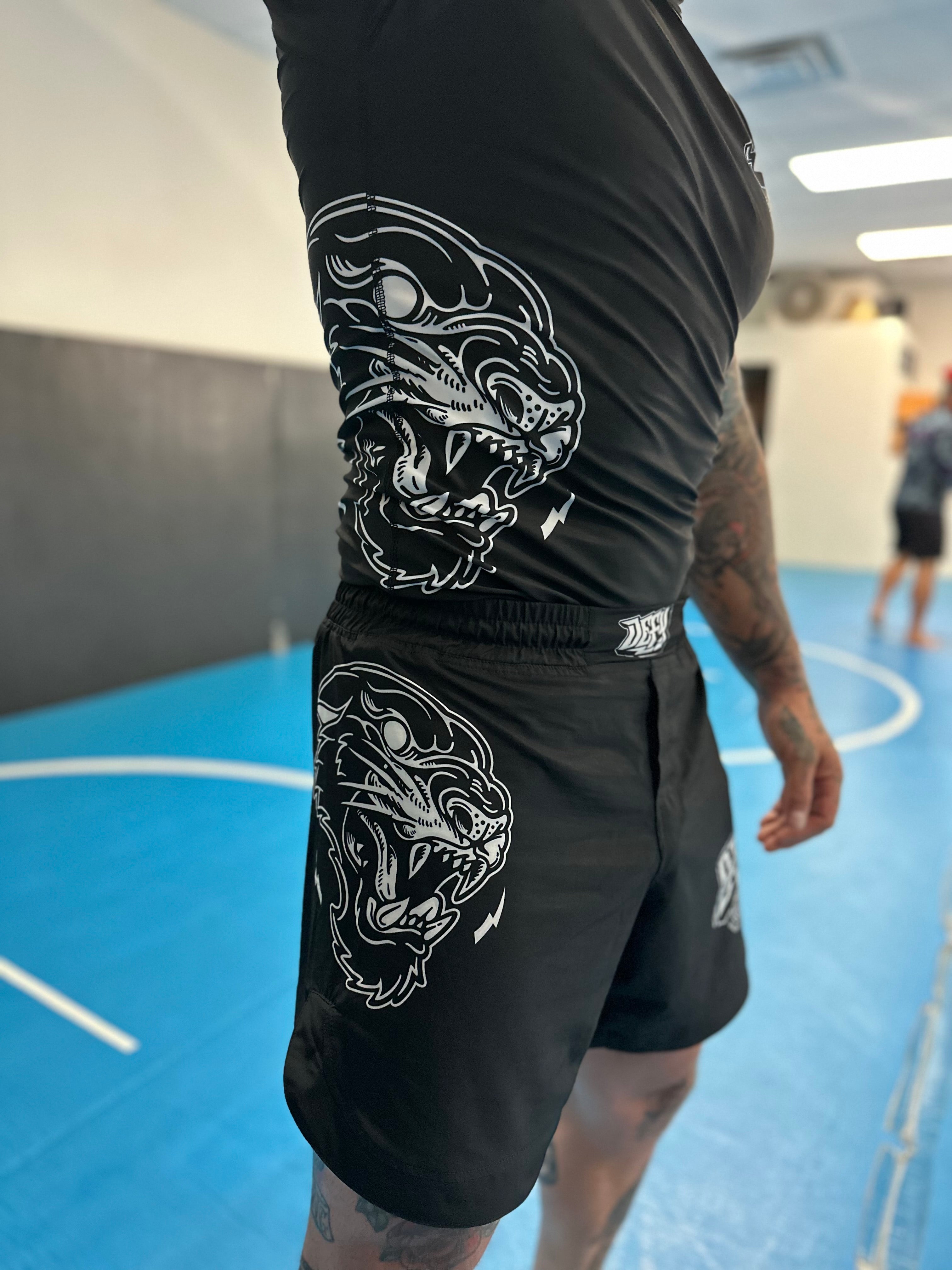 UNLEASH GREATNESS Combat Shorts